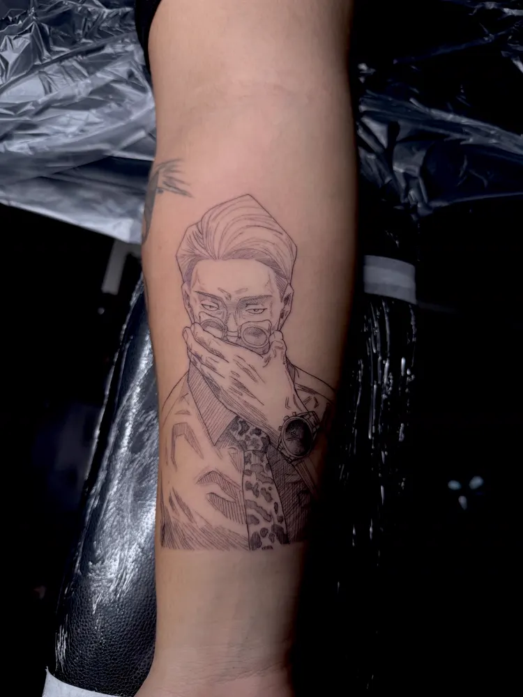 Portrait tattoo of a man in glasses covering his mouth on the forearm